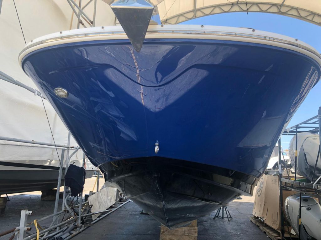 Boat bow refinished in glossy royal blue paint