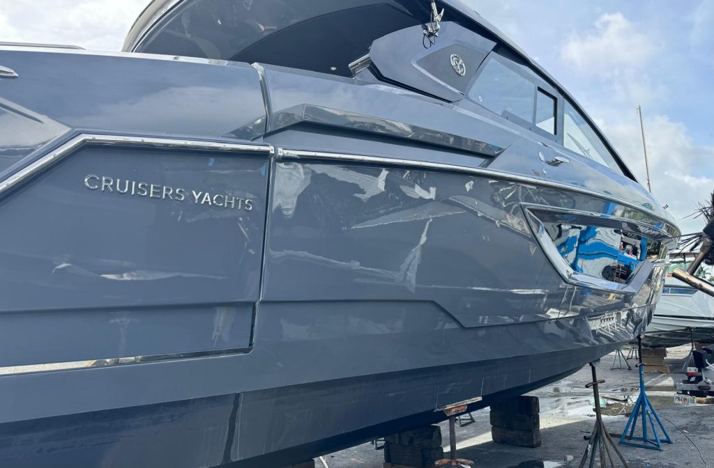 Cruisers Yachts hull refinished in gray with a high-gloss paint finish