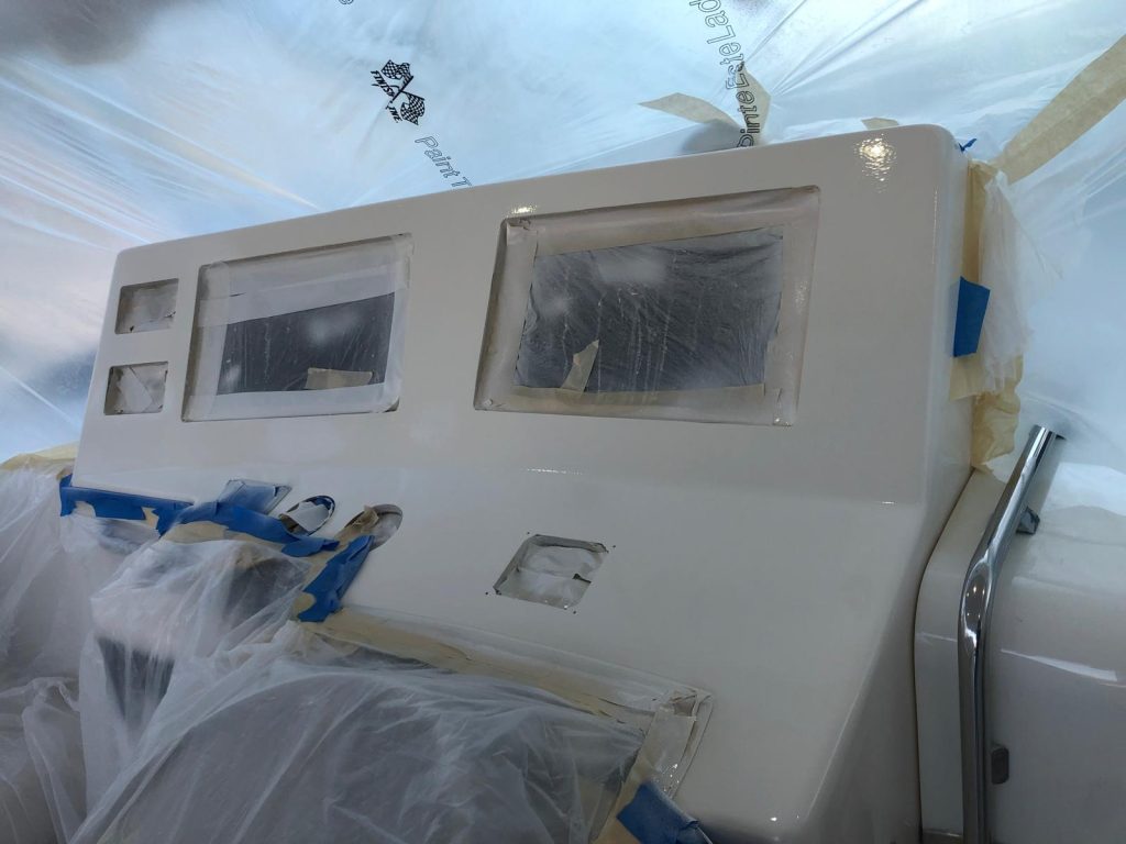 Boat helm panel faired and finished after fiberglass rework of the electronics cutouts