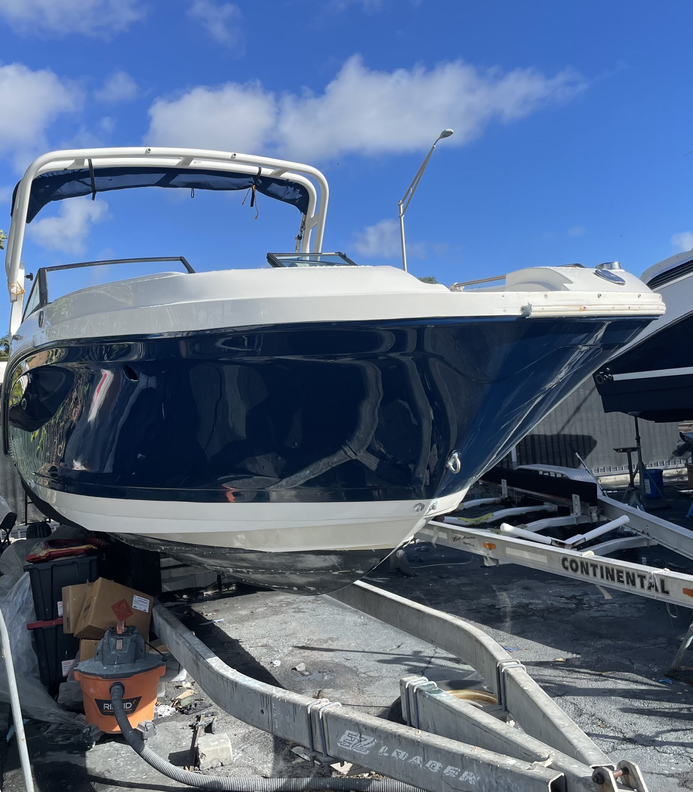 Navy sport boat bow fully restored after collision and fiberglass repair
